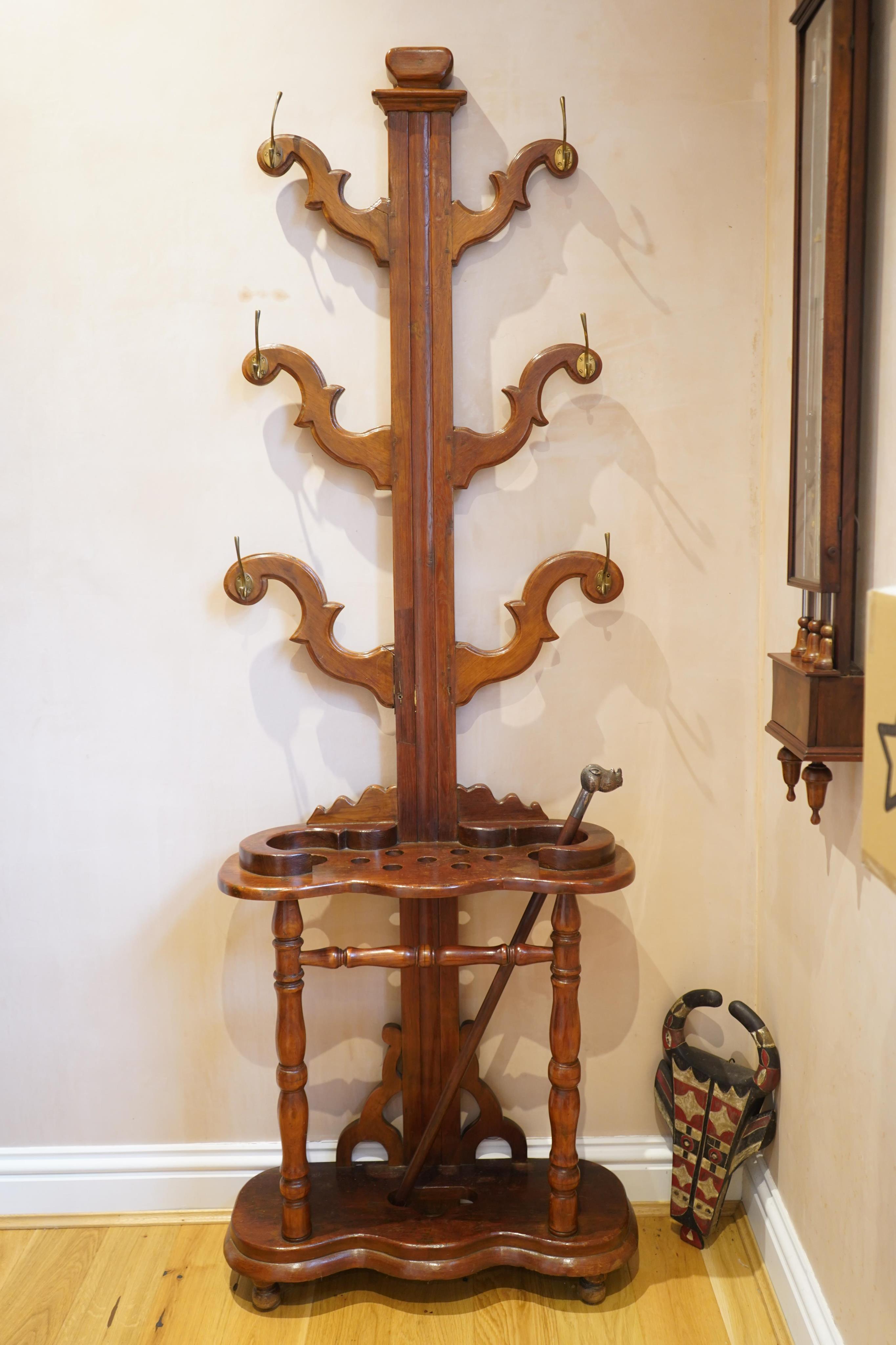 A Victorian style Anglo Indian teak hallstand, width 66cm, height 198cm. Condition - fair